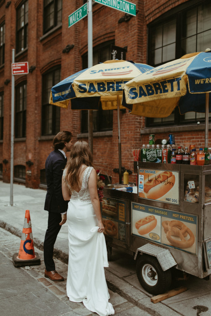 elopement couple getting hotdogs in brooklyn