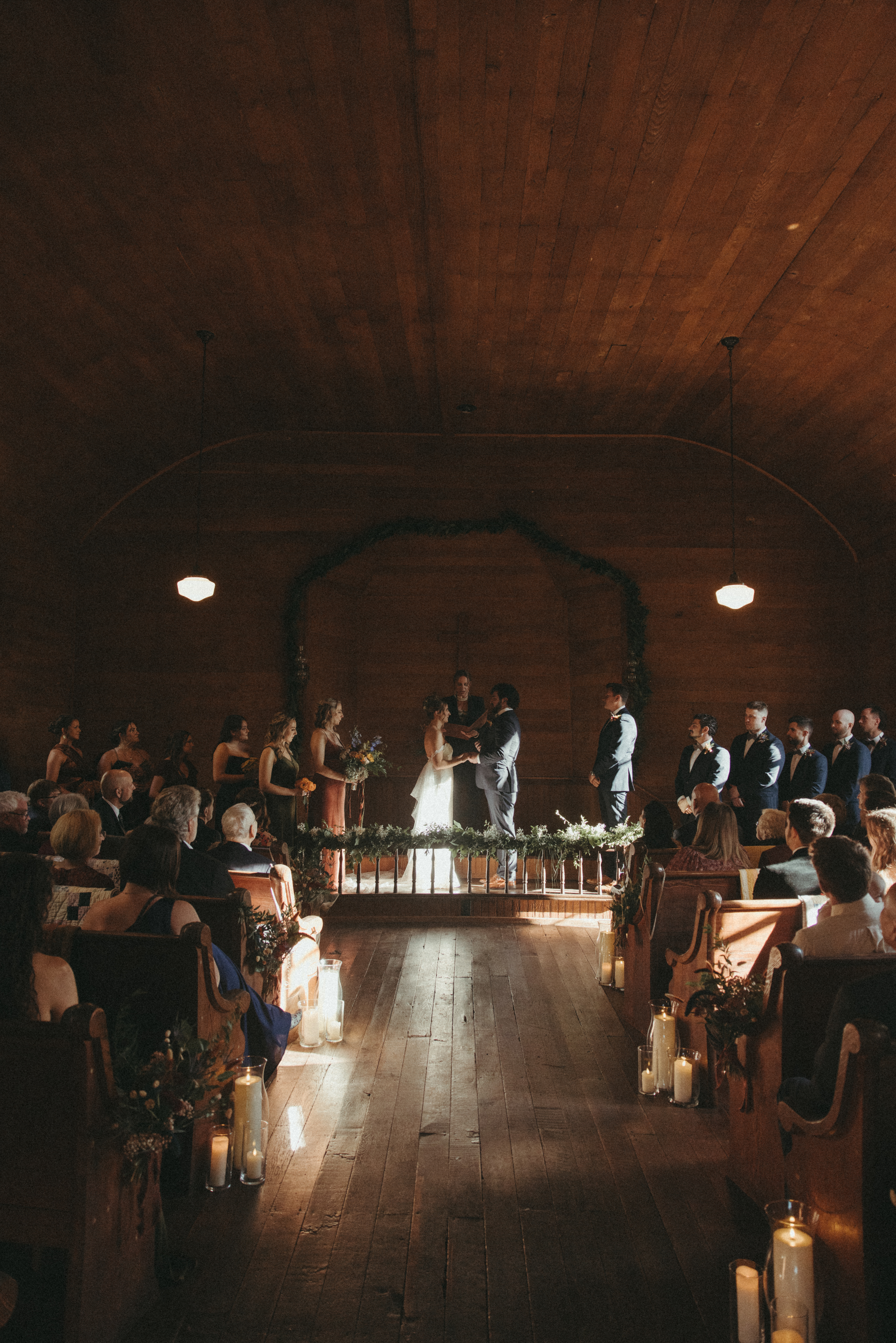 documentary wedding photos in NC at orion schoolhouse and chapel, indoor wedding ceremony, moody wedding photographer for indoor ceremony