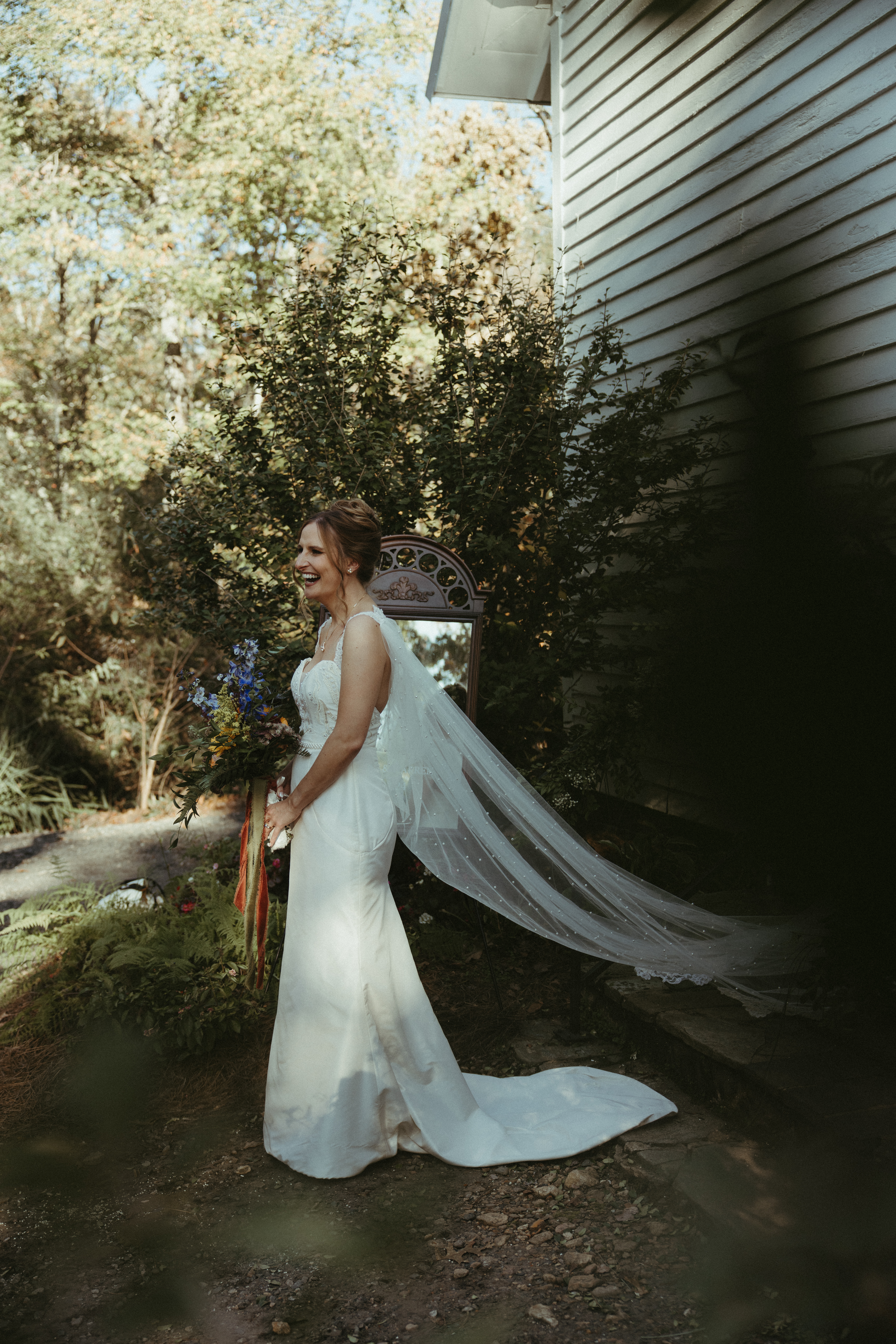 happy bride laughing after wedding ceremony
