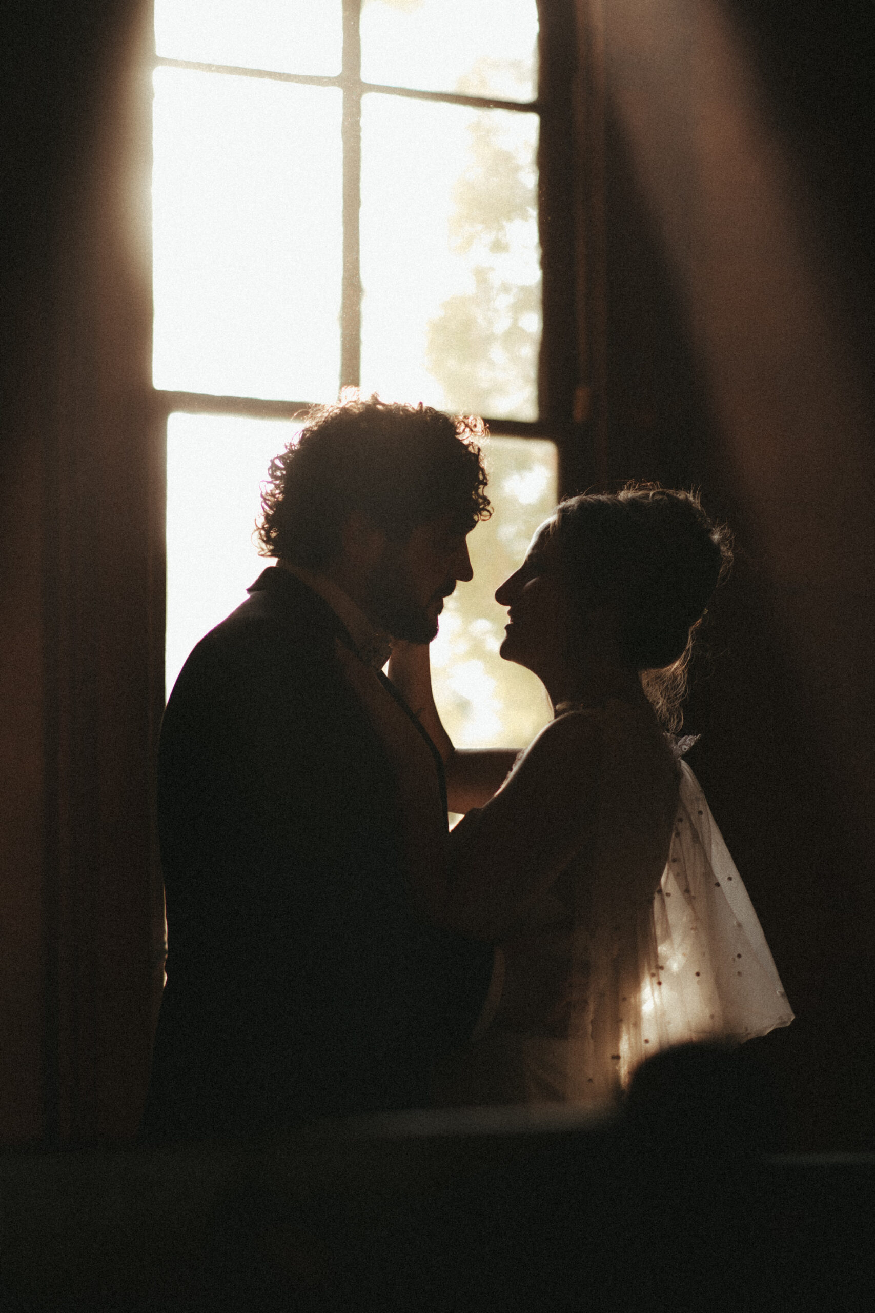 moody cinematic bride and groom photos on wedding day at orion schoolhouse and chapel