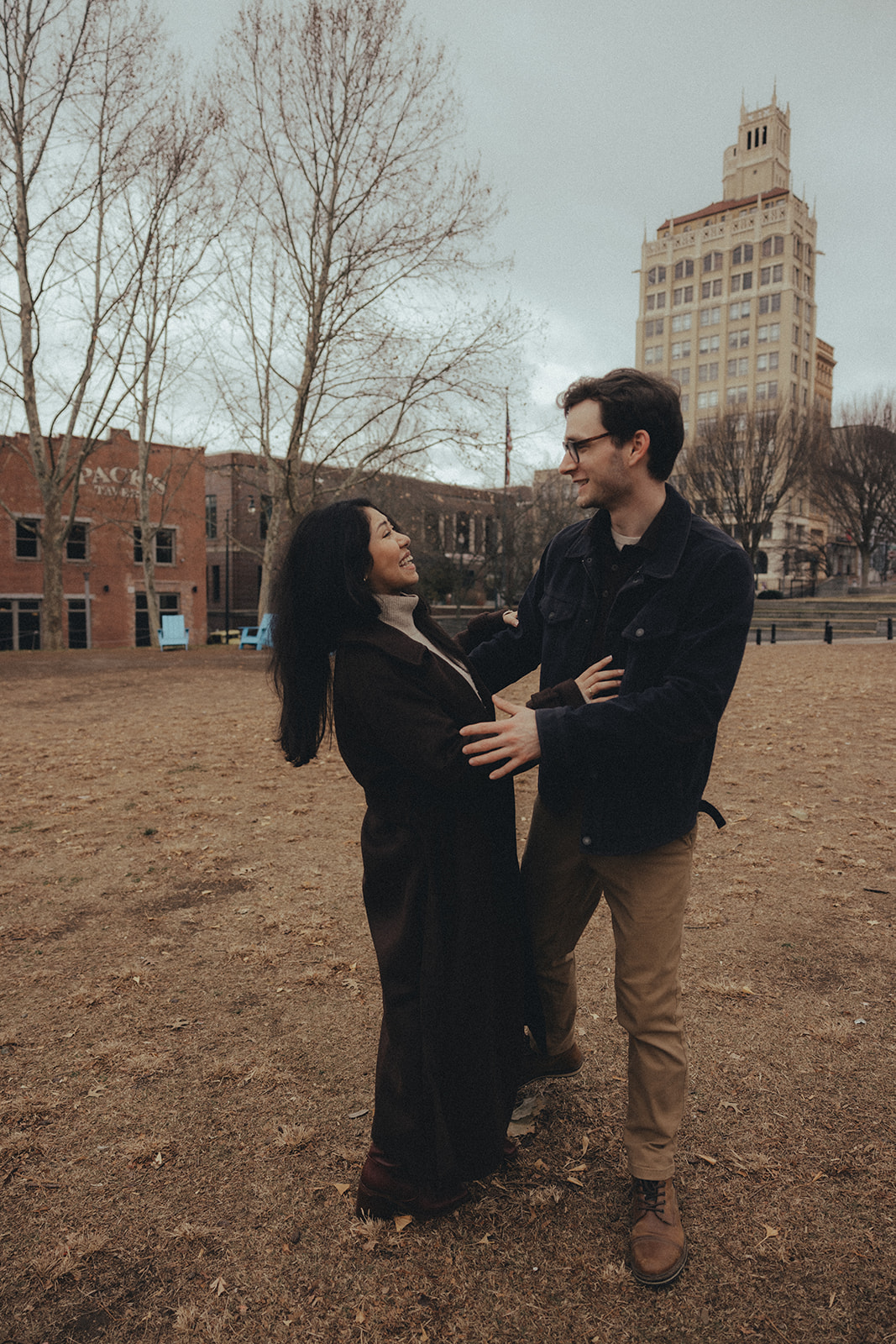 downtown asheville engagement session during winter, fall engagement session outfit inspo